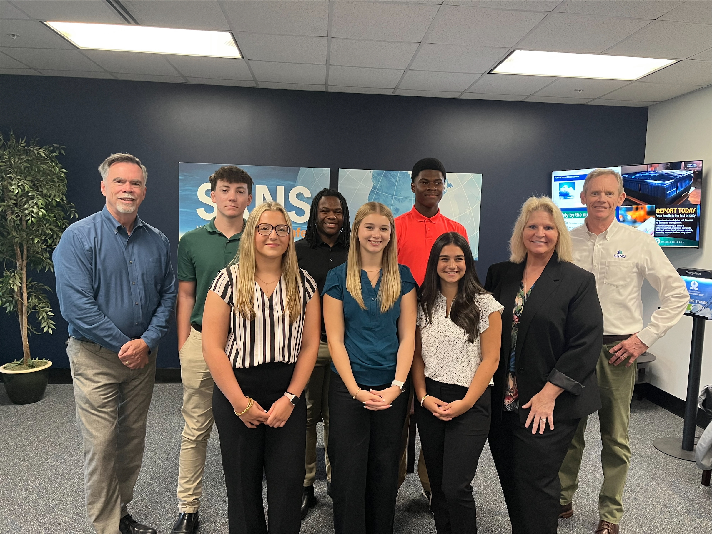 The newly hired apprentices meet Dr. Jeff Griffin, SRNS President and Chief Executive Officer, left, and Jim Dawkins, SRNS Executive Vice President and Chief Operations Officer, right.