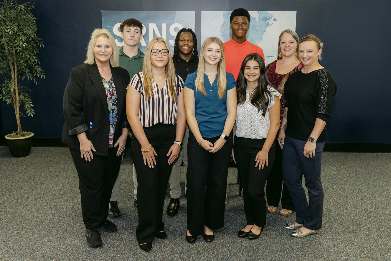 Six youth apprentices join the Savannah River Site (SRS). Front row: BooBoo Roberts, SRS Apprenticeship School Program Manager; Youth Apprentices McKayla Smith, Lillian Garner, and Maya Deskevich; and Kaci Prouty, Project Controls Administrative Assistant. Back row: Youth Apprentices Cohen Harrison, Steven Cook and Carson Williams; and Abigail Bowman, SRNS College Partner, Curriculum, and Pipeline Development Lead.