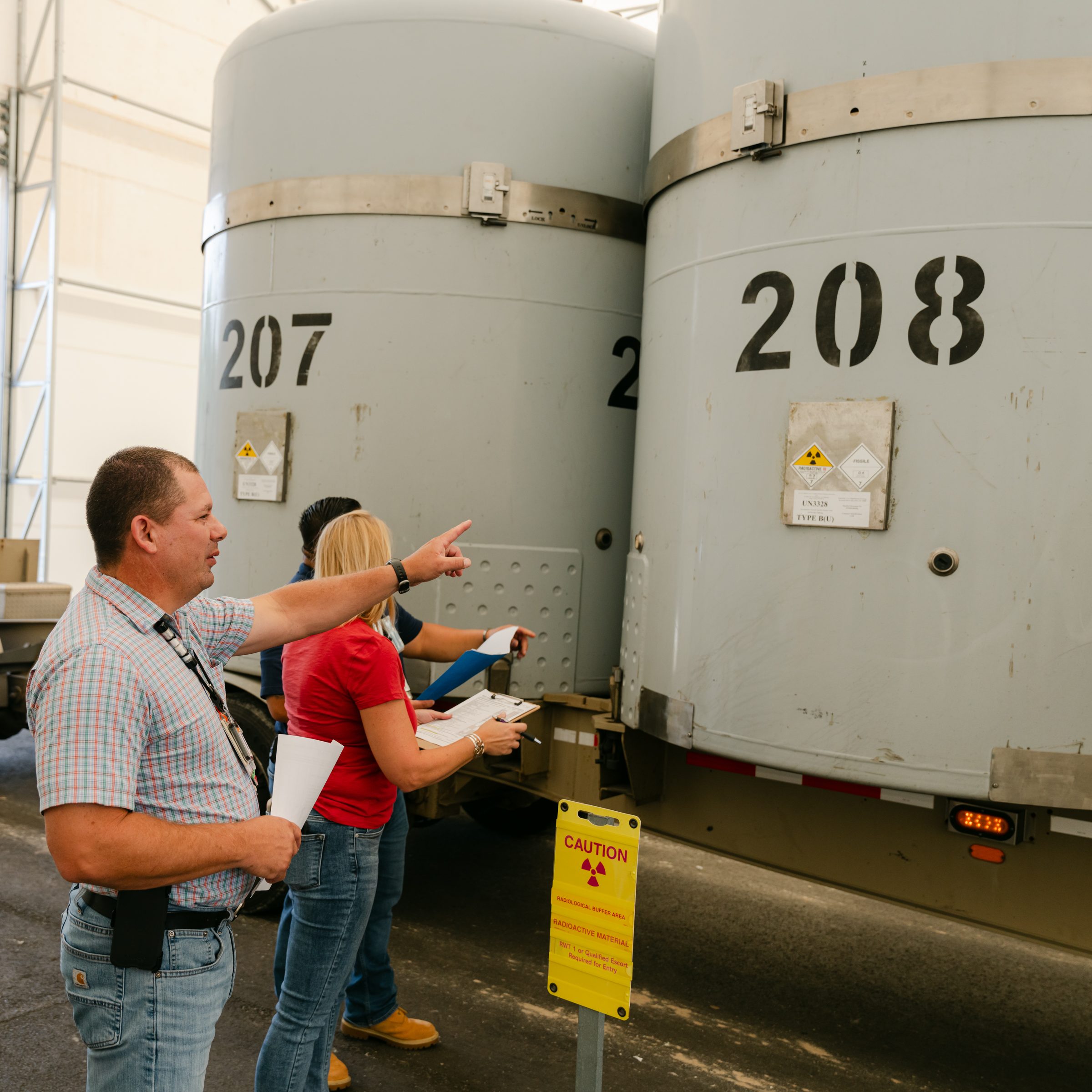 Solid Waste Management employees verify data prior to shipping transuranic waste to the Waste Isolation Pilot Plant in Carlsbad, NM.