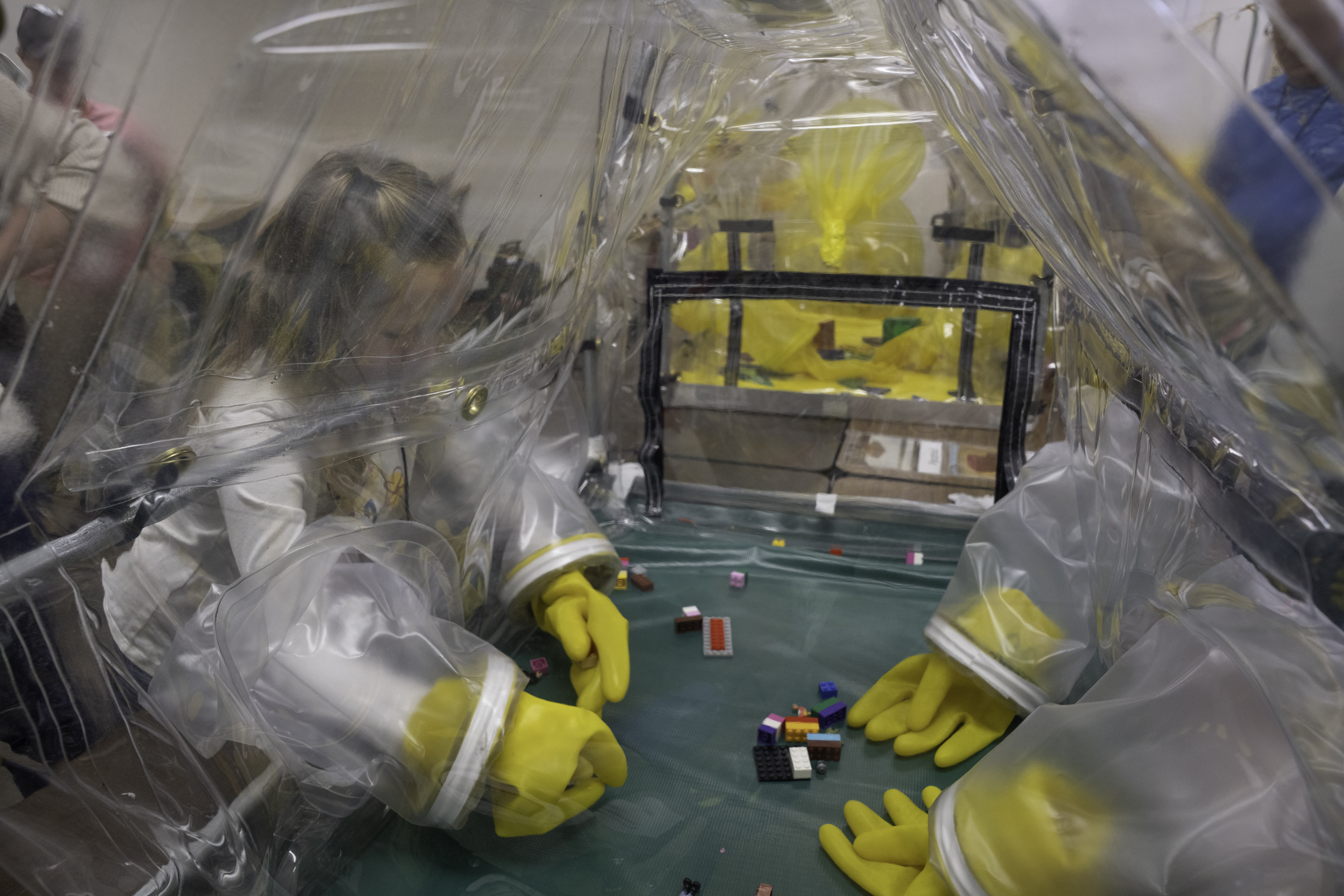 Child-friendly interactive displays available during Family Days included glovebox mock simulators used to manipulate Legos in a controlled environment.