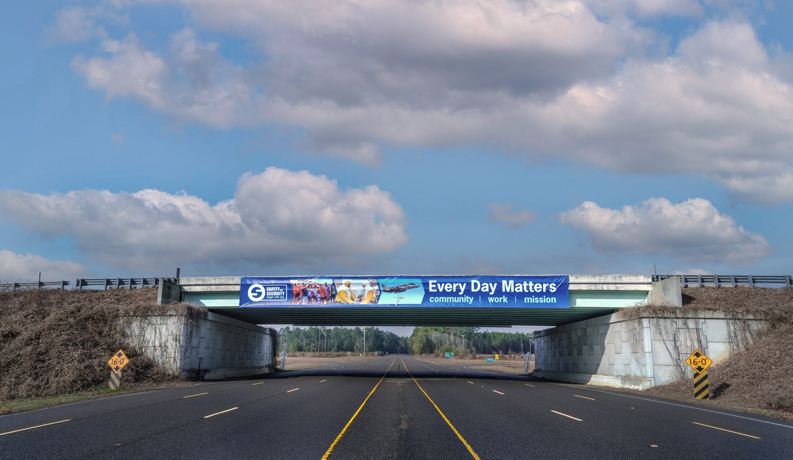 2026 Safety campaign banner over the SRS cloverleaf interchange.